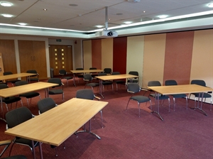 Tables and chairs laid out in cabaret style.